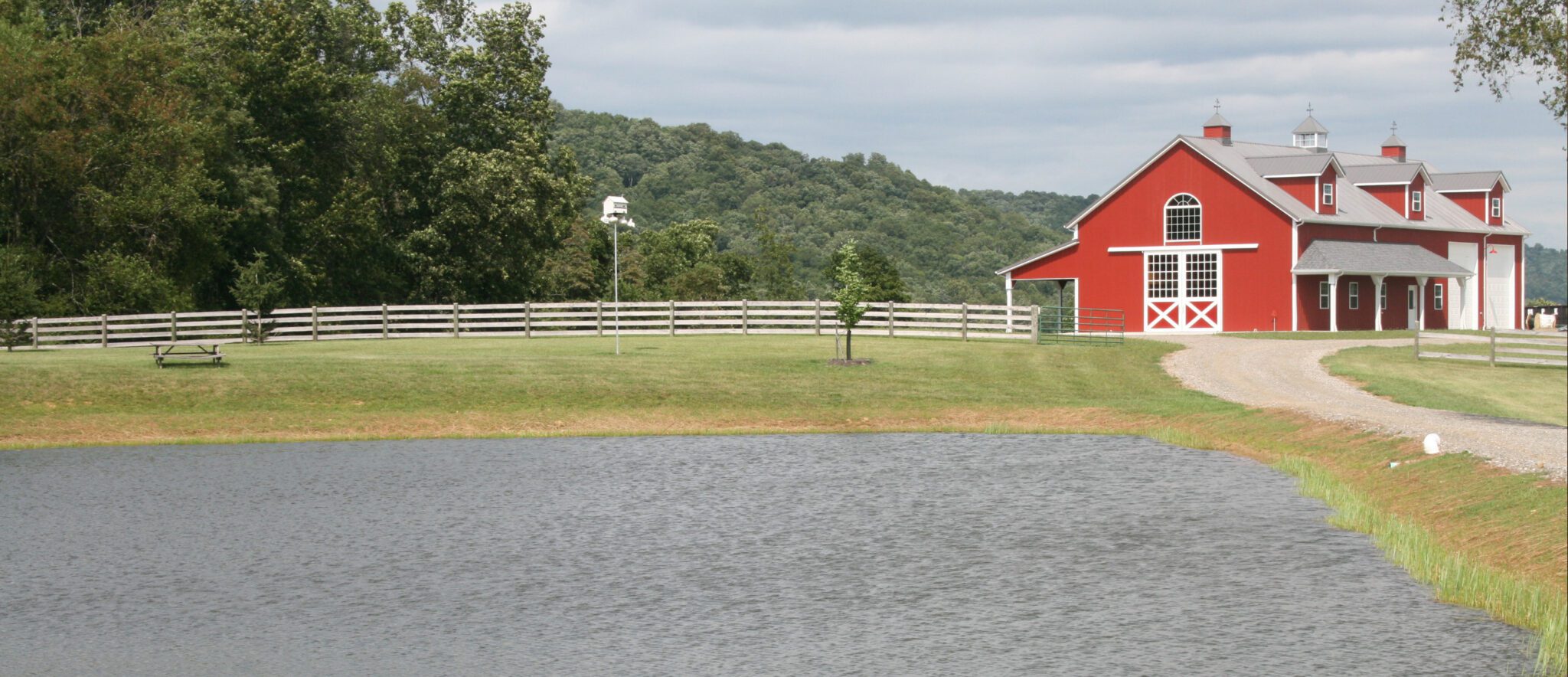 steel-frame-horse-barn-and-pond